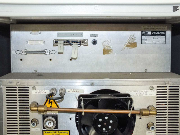 Fritz Hüttinger Elektronik internal assembly – rear panel showing D-sub connectors, ribbon connector, coaxial RF output, and copper RF bar, with Hüttinger type label