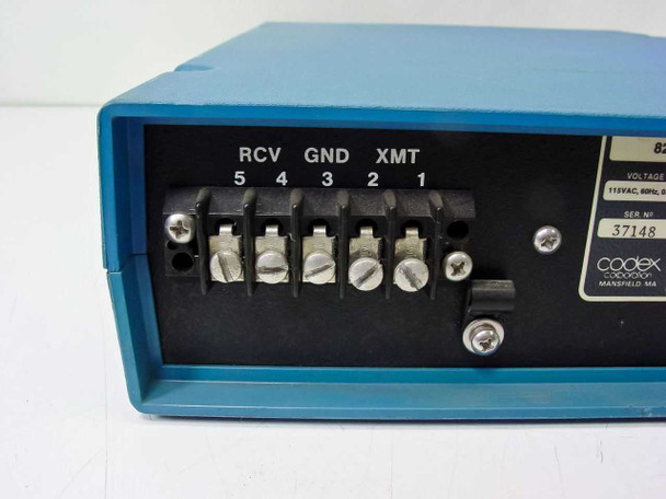 Codex 8250 LDSU rear panel showing screw-terminal line connections labeled RCV (5,4), GND (3), XMT (2,1) and partial view of rating plate