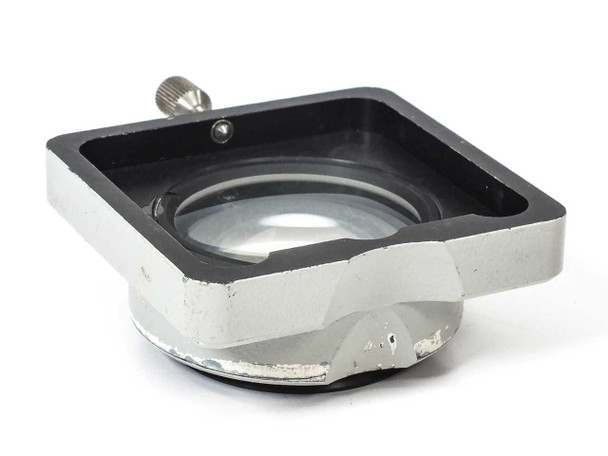Carl Zeiss 47 50 61 SV8 objective — opposite angled view showing chrome body with significant paint chipping and peeling on lower housing