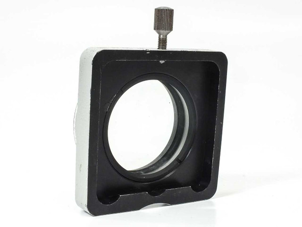 Carl Zeiss 47 50 61 SV8 auxiliary objective — side profile view showing square black shroud, silver body, bayonet mount base, and knurled locking screw