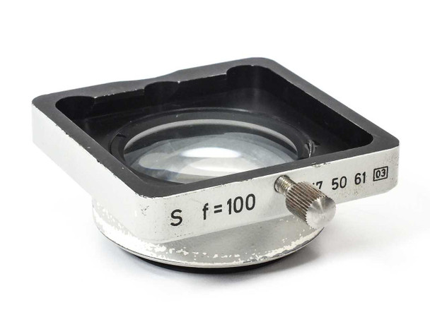 Carl Zeiss 47 50 61 SV8 auxiliary objective f=100 — angled front view showing lens element and label with S f=100 and part number markings