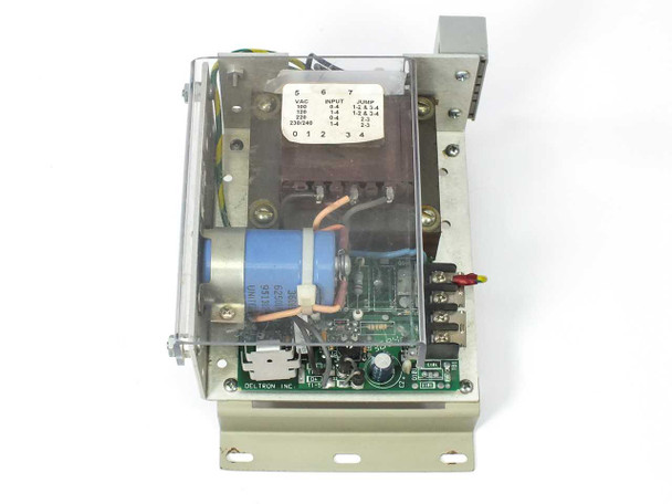 Deltron W109B open frame linear power supply – top interior view showing voltage tap jumper chart (positions 5-7), transformer, and Deltron PCB