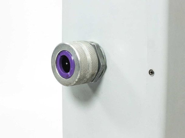 Close-up of stainless steel cable gland with purple seal installed on side of Stahlin J1614HW fiberglass enclosure