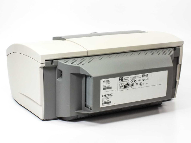 HP Business Inkjet 2200se — rear view showing FCC certification label, HP product labels, ventilation slots, and expansion bay covers