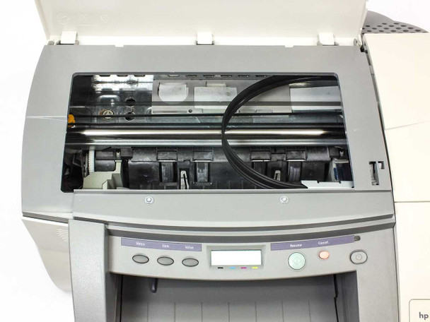 HP C2689A interior — top cover open showing print head carriage rail, 4-slot MIDS ink cartridge bay, and drive belt