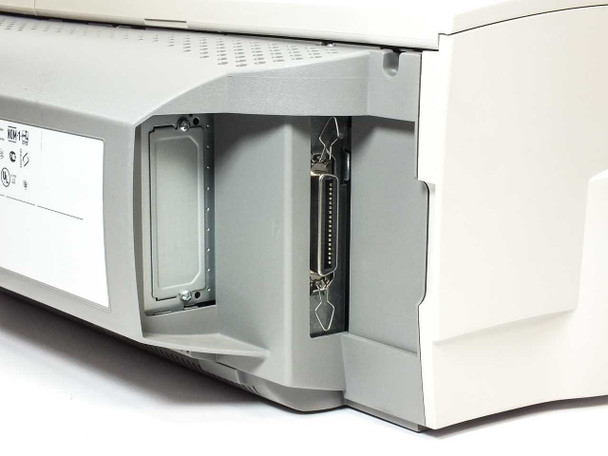 HP C2689A rear right corner — parallel (DB-25 Centronics) port and second expansion slot visible