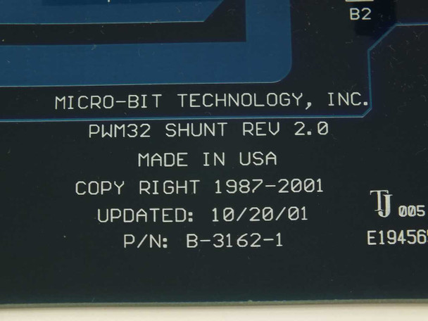 Close-up of PCB silkscreen label reading: Micro-Bit Technology Inc., PWM32 Shunt Rev 2.0, Made in USA, Copyright 1987–2001, Updated 10/20/01, P/N B-3162-1
