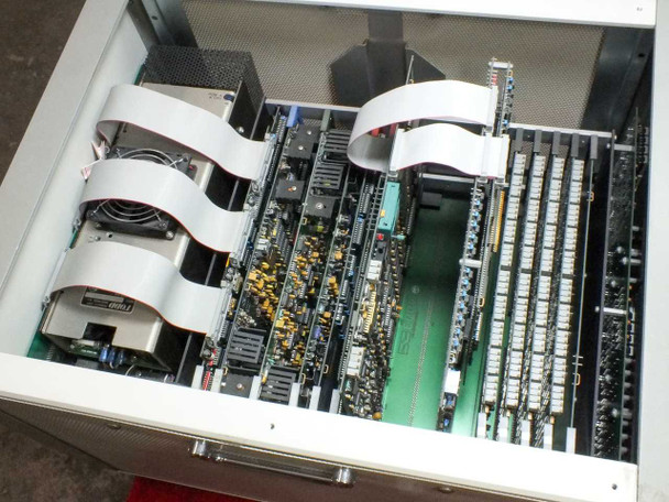 Epro 142AX interior view with lid open – showing full set of installed test boards with ribbon cable connections, fan, and power supply