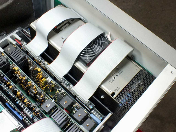 Epro 142AX interior detail – power supply module, cooling fan, and additional test board cards with ribbon cable harnesses