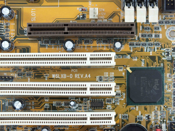 Wintac W6LXB-0 REV.A4 PCB silkscreen close-up showing model number, revision, and Slot 1 CPU socket detail