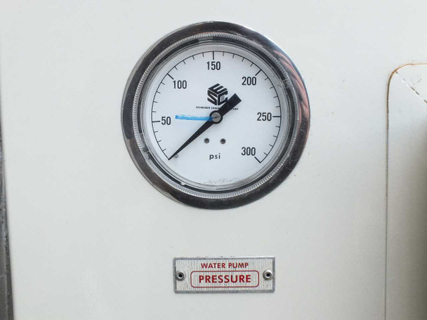 Water pump pressure gauge close-up — 0–300 PSI analog gauge labeled WATER PUMP PRESSURE