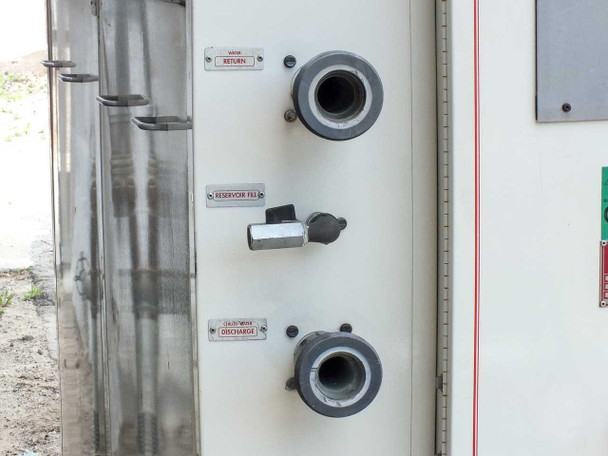 Chilled water connection panel — WATER RETURN, RESERVOIR FILL valve, and CHILLED WATER DISCHARGE large-diameter ports