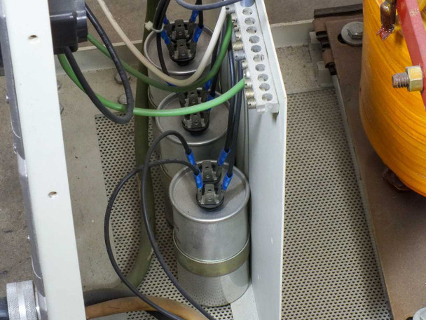 AAA Power System CP6 internal detail — capacitor bank assembly with multiple cylindrical capacitors and wiring connections