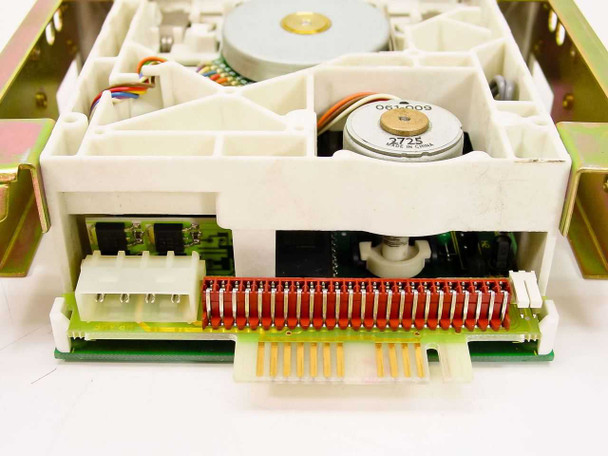 Colorado 120MB tape drive interior view showing drive mechanism, spindle motor, tape transport components, and pin and edge connector headers on bottom board