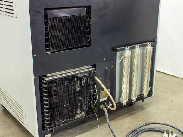 Sorvall RC-80 rear lower compartment showing refrigeration condenser coil with heavy debris/dust buildup and three resistor cooling fin columns