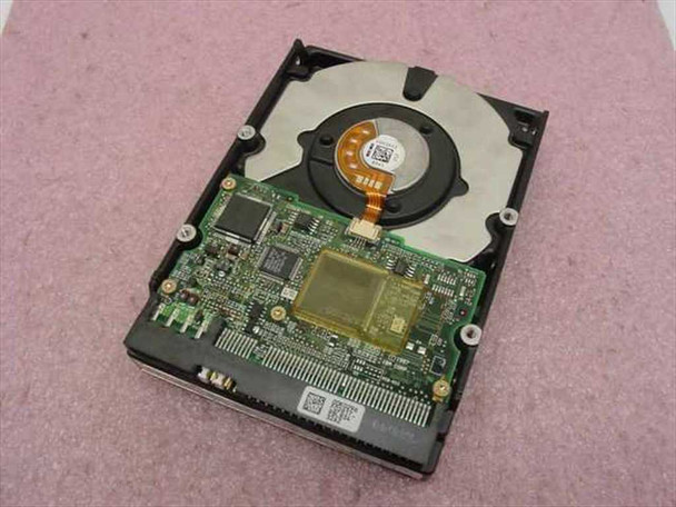 IBM DTTA-351010 hard drive — PCB controller board view showing main controller IC and flex cable