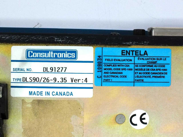 Spirent DLS 90 bottom label showing serial number DL91277, Type DLS90/26-9.35 Ver 4, Made in Canada, Consultronics branding, and ENTELA CSA field evaluation mark