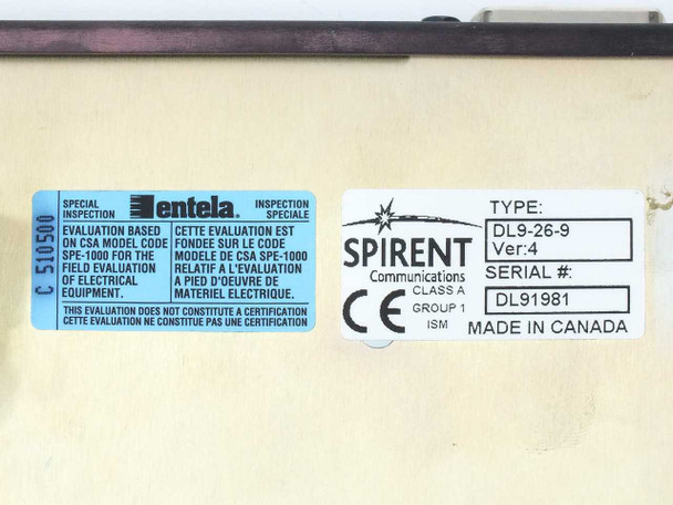 Spirent DLS 90 bottom label showing Type DL9-26-9 Version 4 serial number and Entela CSA inspection sticker