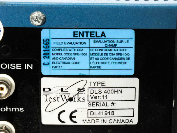 Spirent DLS 400HN Ver 11 rear panel label – ENTELA CSA field evaluation sticker and DLS TestWorks type/serial number label showing DL41918
