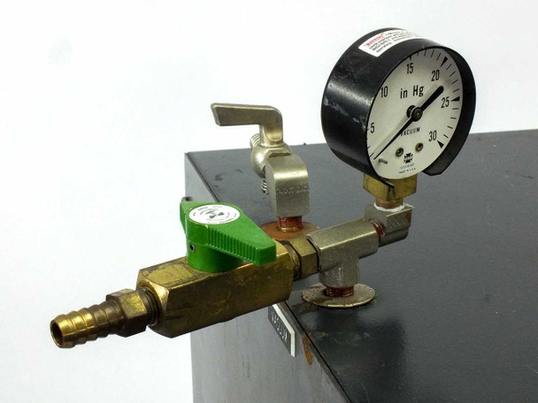 Lab-Line 3620ST Duo Vac Vacuum Oven top vacuum fitting assembly showing brass manifold, green quarter-turn valve, lever shutoff valve, and 0–30 in Hg vacuum gauge