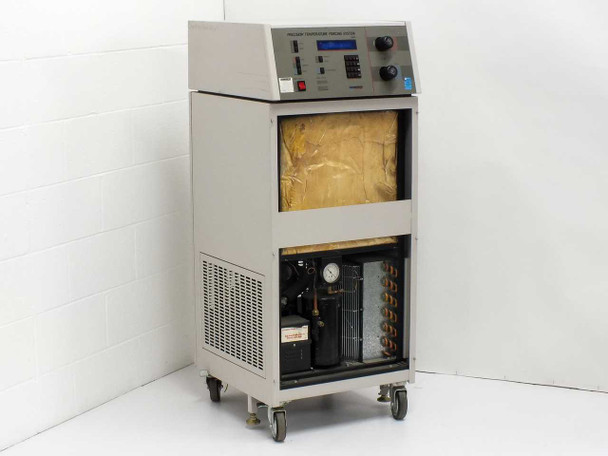 Thermonics T-2423 console right-side view showing front panel controls, LCD display, and vented lower enclosure on casters
