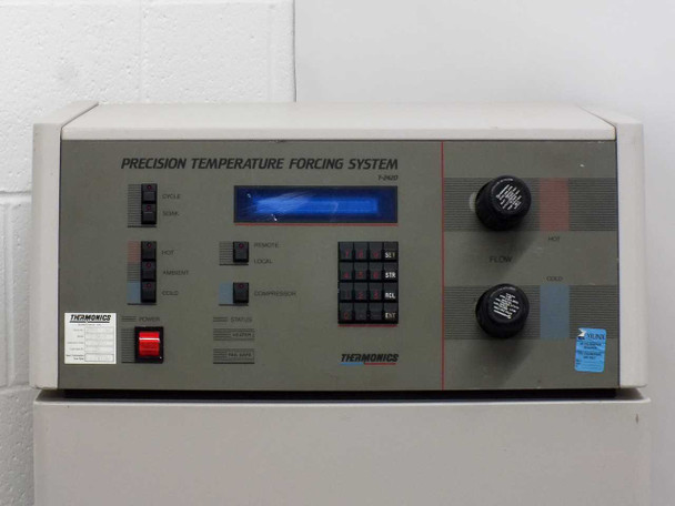 Thermonics T-2423 console with lower access panel open revealing internal refrigeration compressor, pressure gauge, and heat exchanger components