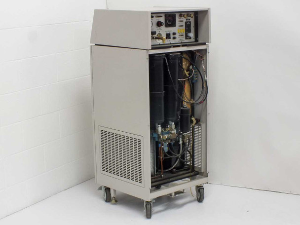 Rear three-quarter view of Thermonics T-2423 console with top lid open showing rear panel connections and vented lower enclosure