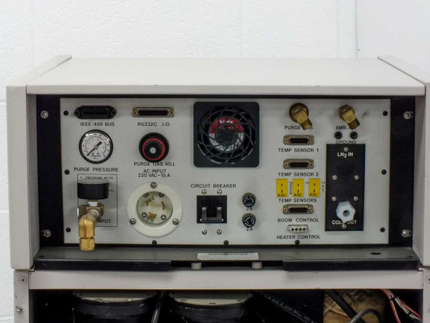 Thermonics T-2423 rear view with side panel removed showing internal plumbing, solenoid valves, refrigerant lines, hoses, and wiring harness