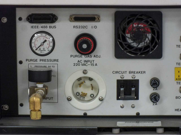 Close-up of Thermonics T-2423 rear panel showing IEEE/488 BUS connector, RS-232C I/O port, purge pressure gauge, purge gas adjust, AC Input 220VAC-15A twist-lock receptacle, circuit breaker, temp sensor 1, temp sensor 2, temp sensors block, boom control, heater control, cold out port, LN2 IN port, AMB/ground connections