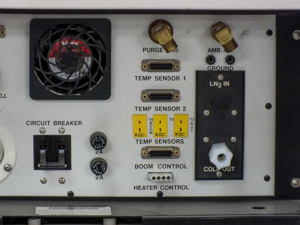 Close-up of upper-left rear panel showing IEEE-488 BUS connector, RS-232C I/O connector, purge gas adjustment control, AC INPUT 220VAC-15A label with twist-lock power inlet, circuit breaker switches, and purge pressure gauge