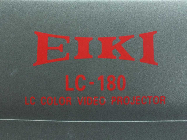 Eiki LC-180 close-up of front badge reading EIKI LC-180 LC COLOR VIDEO PROJECTOR