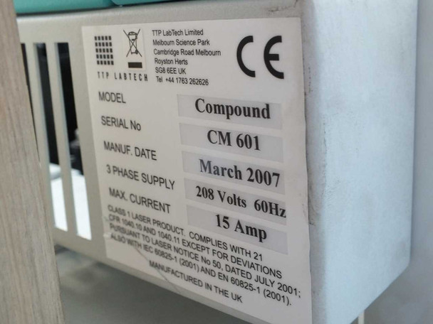 TTP Labtech comPOUND CM601 rating plate showing model CM601, serial CM601, manufacture date March 2007, 208V 60Hz 15A 3-phase supply, Class 1 laser product