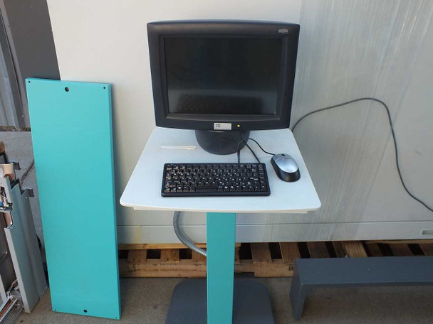 Control workstation for TTP Labtech comPOUND CM601 showing flat-panel monitor, keyboard, and mouse on pedestal stand