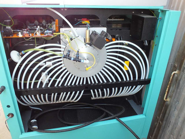 Interior view of TTP Labtech comPOUND CM601 showing circular sample carousel tube coil system and internal control electronics