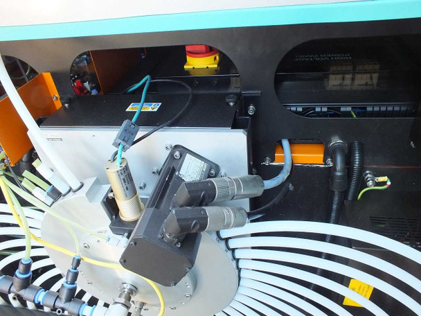 Interior rear of TTP Labtech comPOUND CM601 showing robotic drive motors, actuators, pneumatic tubing, and control module