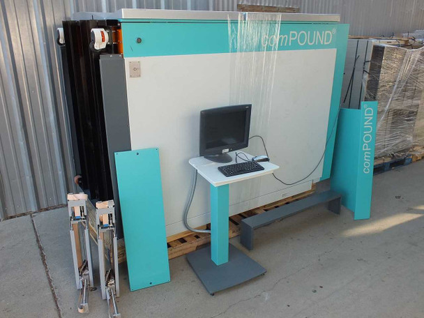 TTP Labtech comPOUND CM601 automated sample storage freezer shown disassembled outdoors with control workstation, panels, and robotic arm components on pallet