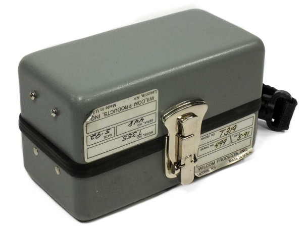 Wilcom T319 and T355 units stacked showing both bottom labels with model numbers, serial numbers, and date codes