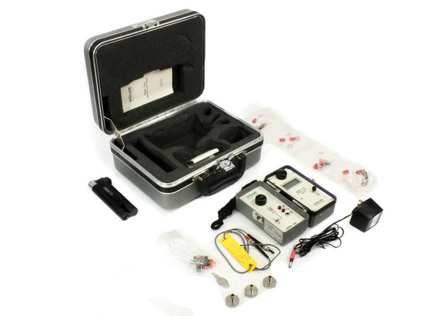 Wilcom T319 T355 optical level meter transmitter set laid out with carrying case, AC adapter, and accessories