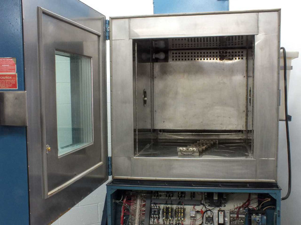 Thermotron SM-16-SL chamber interior close-up with door open, stainless steel inner chamber walls and perforated ceiling diffuser plate visible