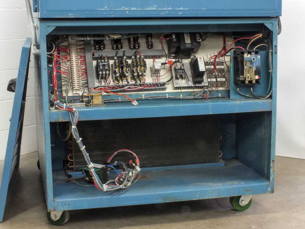 Thermotron SM-16-SL lower control compartment with access panel removed, showing relay contactors, terminal strips, and wiring harness