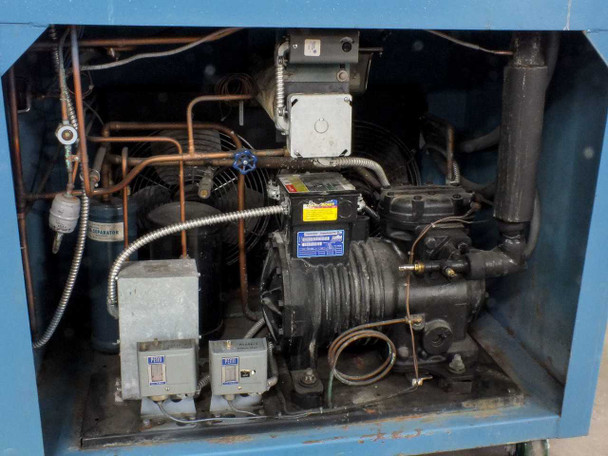 Thermotron SM-16-SL refrigeration compressor compartment showing compressor, copper refrigerant lines, and two Friga-Bohn or similar compressor start capacitor/relay boxes