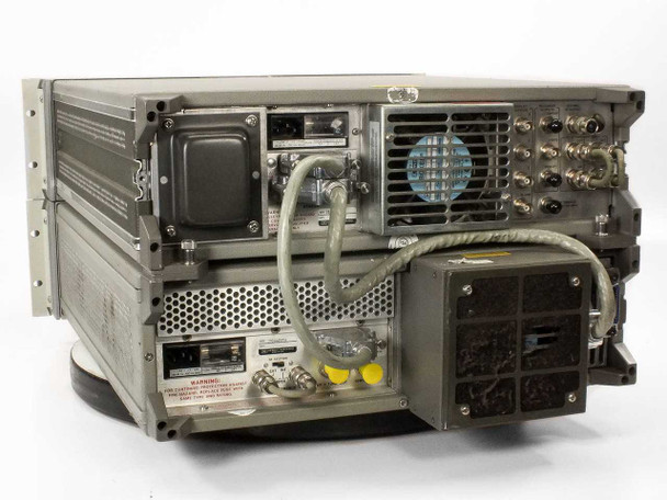 HP 8566B two-unit stack rear view — power section, large cooling fan, BNC outputs, and inter-unit cabling visible