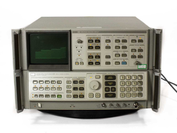 HP Agilent 8566B Spectrum Analyzer front 3/4 angle — both units stacked, live spectrum trace visible on CRT display