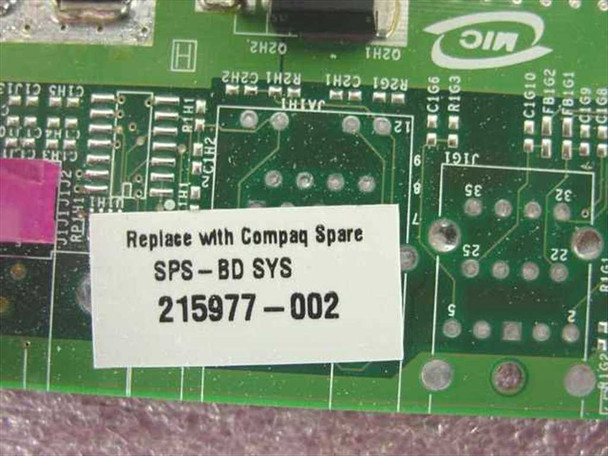 Compaq 215977-002 motherboard label close-up showing part number SPS-BD SYS 215977-002 and MIC logo