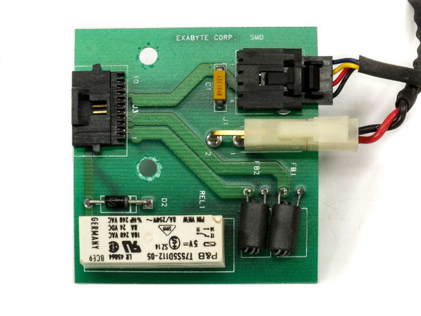 Front face of Exabyte Corp SMD drive board showing P&B relay T75S5D112-05, white Molex connector, black header connectors, and edge connector