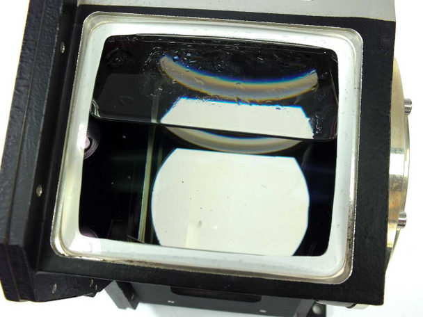 Hughes Elcan 900612-002 R/G Prism Assembly – three-quarter front-left view showing black anodized housing with open top aperture and label