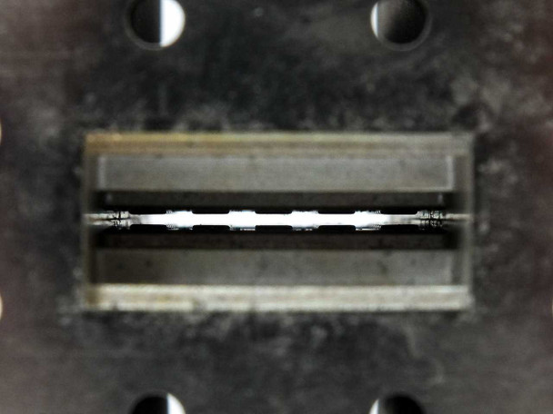 Varian F137CA6 WR-137 waveguide flange interior – close-up of waveguide aperture showing internal absorber/termination element