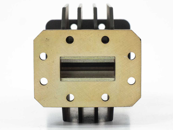 Varian F137CA2 WR-137 waveguide — brass flange face showing rectangular waveguide aperture and six bolt holes