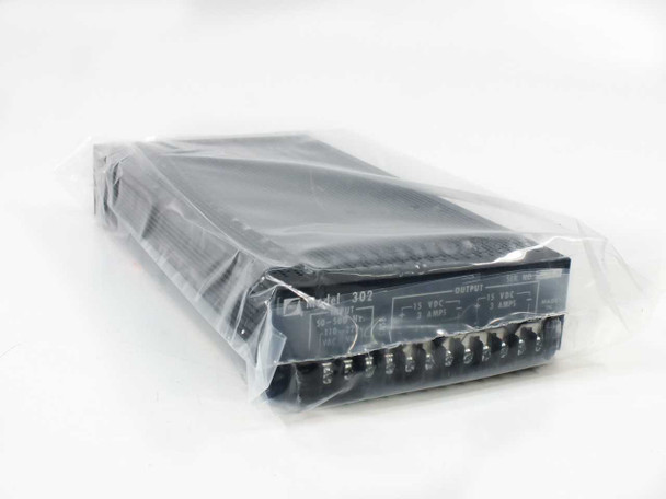 RO Associates Model 302 dual output 15VDC power supply in original clear plastic wrap, front panel and output terminal block visible