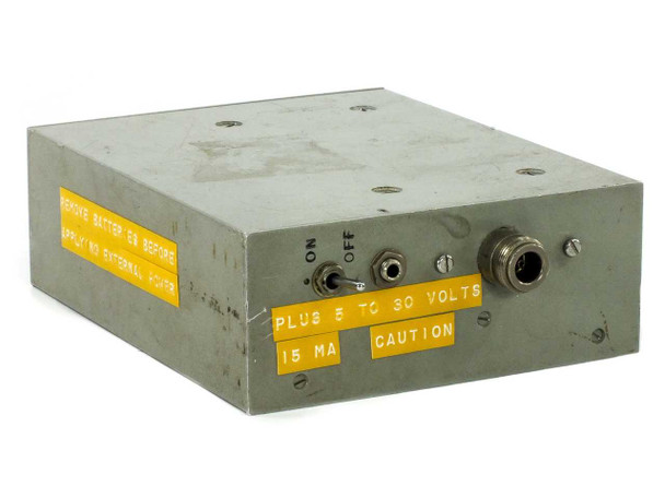 International Microwave ACP3959-20CB Tunnel Diode Amplifier – front/top panel view showing ON/OFF toggle switch, coax connector, and yellow warning labels indicating +5 to 30V DC at 15 mA